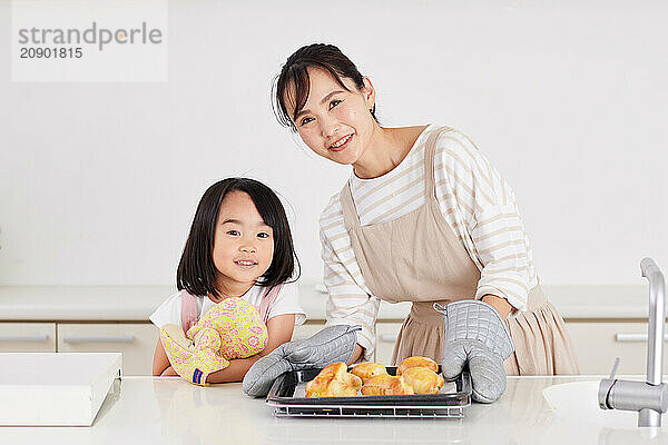 Japanese mother and daughter cooking in the kitchen