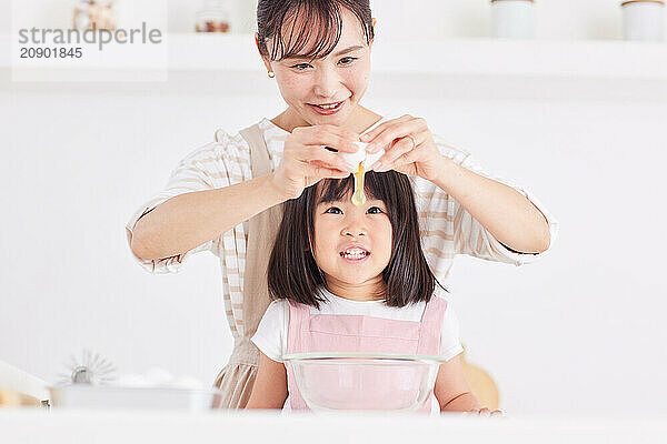 Japanese mother and daughter cooking in the kitchen