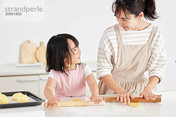 Japanese mother and daughter cooking in the kitchen