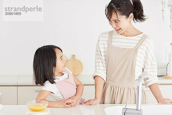 Japanese mother and daughter cooking in the kitchen