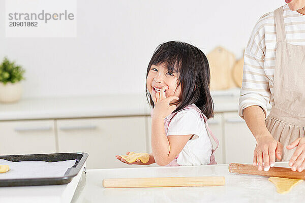 Japanese mother and daughter cooking in the kitchen