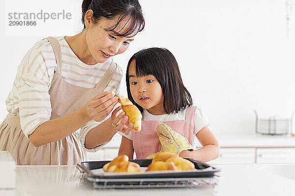 Japanese mother and daughter cooking in the kitchen