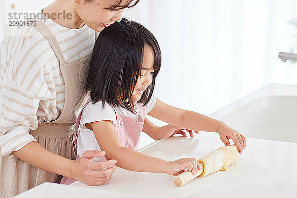 Japanese mother and daughter cooking in the kitchen