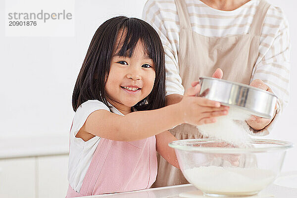 Japanese mother and daughter cooking in the kitchen