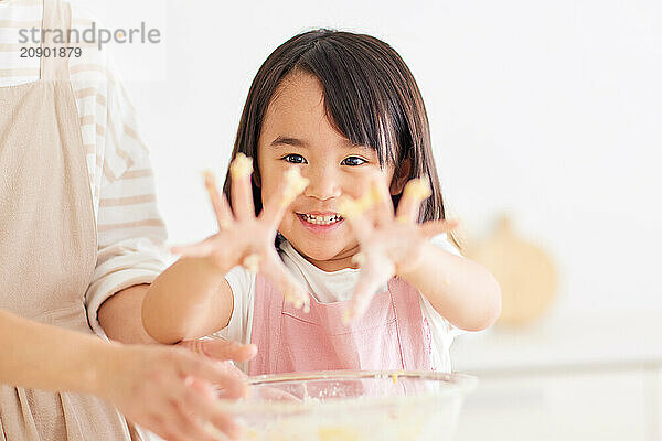 Japanese mother and daughter cooking in the kitchen