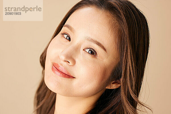 Asian Woman With Long Hair And A Smile