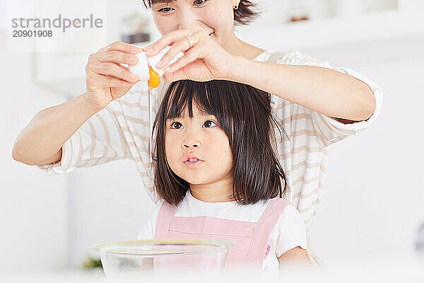 Japanese mother and daughter cooking in the kitchen