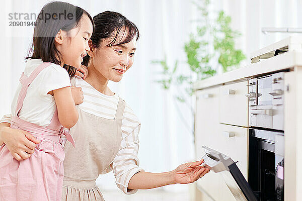 Japanese mother and daughter cooking in the kitchen