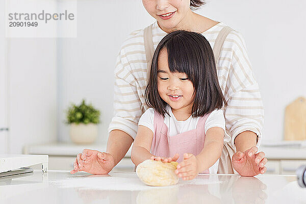 Japanese mother and daughter cooking in the kitchen