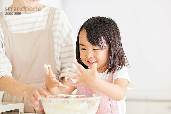 Japanese mother and daughter cooking in the kitchen