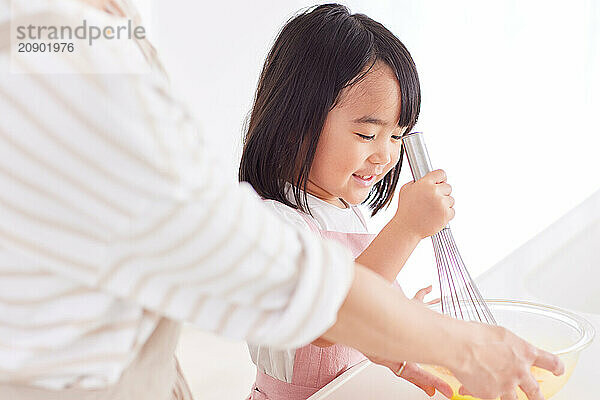 Japanese mother and daughter cooking in the kitchen