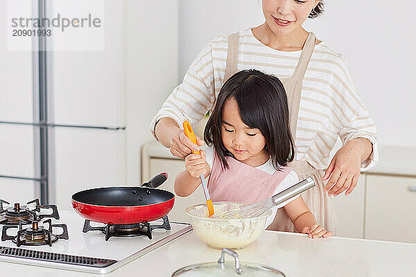 Japanese mother and daughter cooking in the kitchen