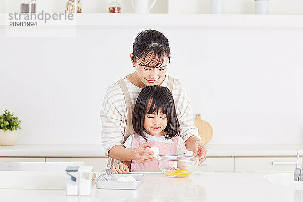 Japanese mother and daughter cooking in the kitchen