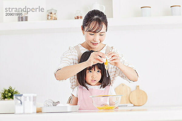 Japanese mother and daughter cooking in the kitchen