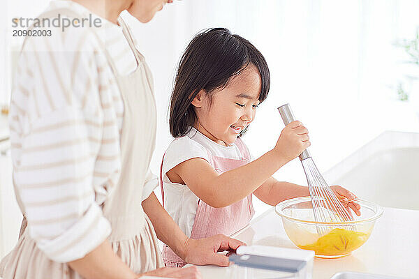 Japanese mother and daughter cooking in the kitchen