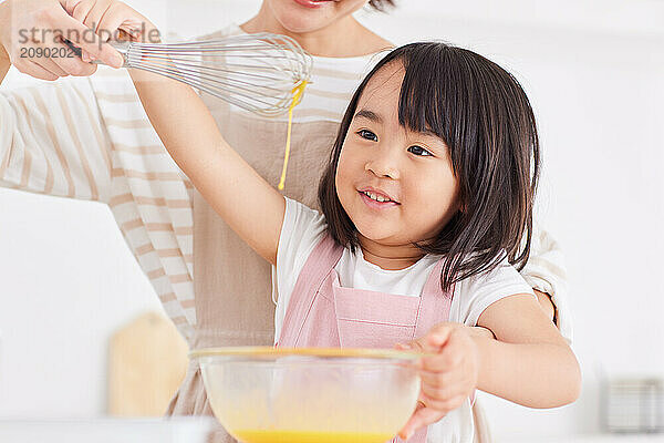 Japanese mother and daughter cooking in the kitchen