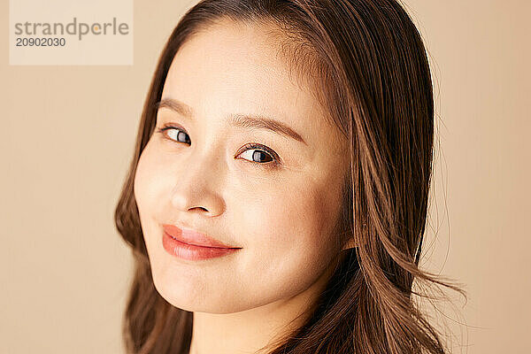 Asian Woman With Long Hair And A Smile