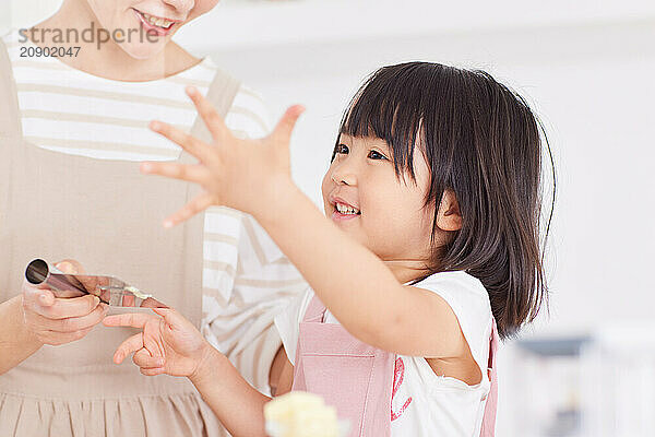 Japanese mother and daughter cooking in the kitchen