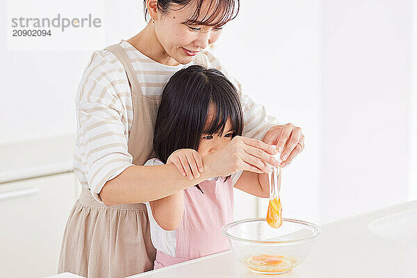 Japanese mother and daughter cooking in the kitchen