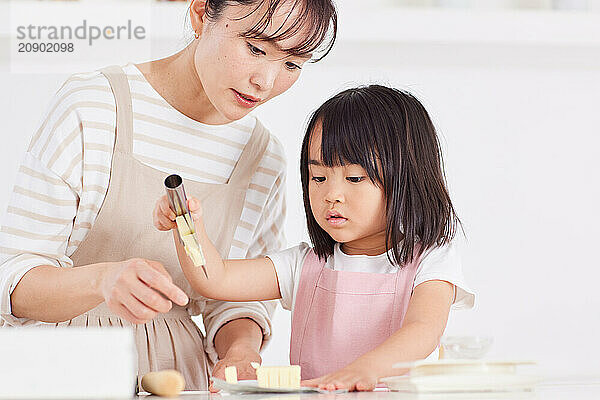 Japanese mother and daughter cooking in the kitchen