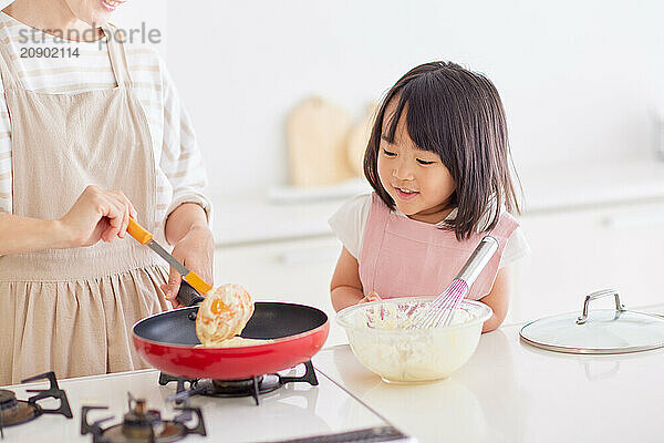 Japanese mother and daughter cooking in the kitchen