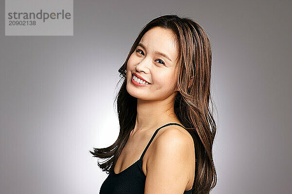 Asian Woman With Long Brown Hair Smiling