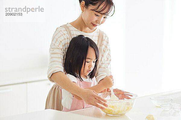 Japanese mother and daughter cooking in the kitchen