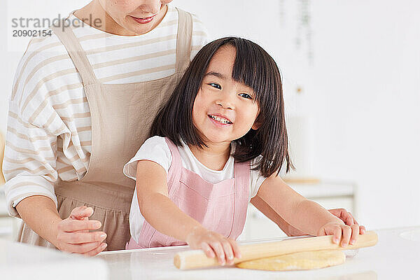 Japanese mother and daughter cooking in the kitchen