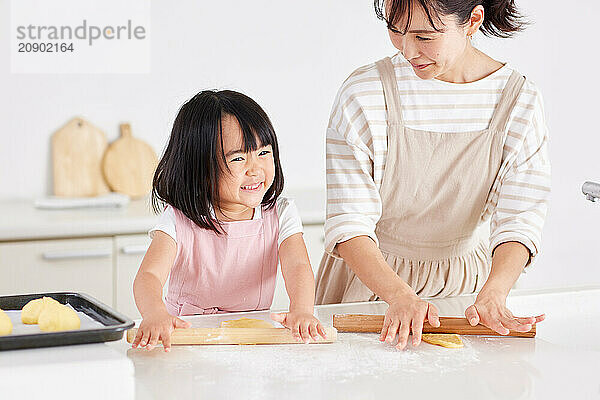 Japanese mother and daughter cooking in the kitchen