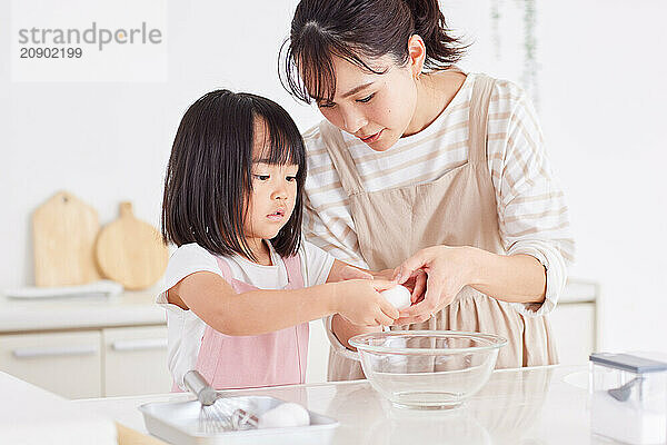 Japanese mother and daughter cooking in the kitchen