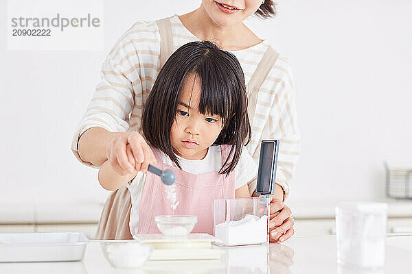 Japanese mother and daughter cooking in the kitchen