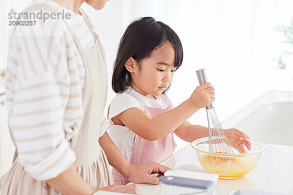 Japanese mother and daughter cooking in the kitchen