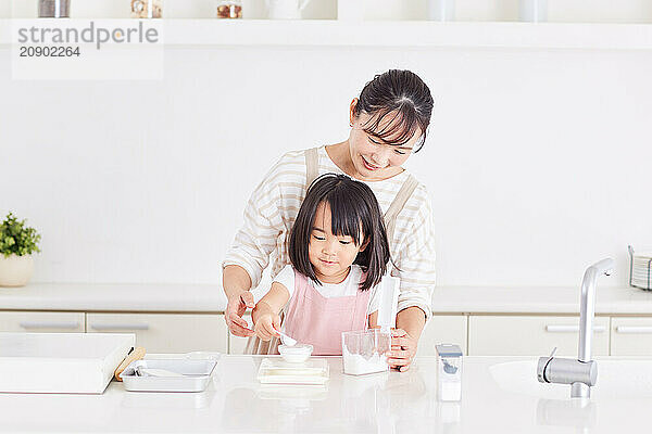 Japanese mother and daughter cooking in the kitchen