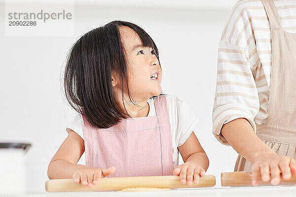 Japanese mother and daughter cooking in the kitchen