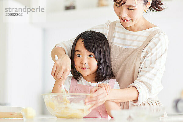 Japanese mother and daughter cooking in the kitchen