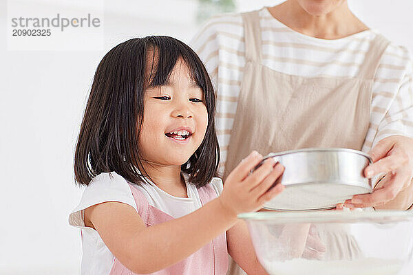 Japanese mother and daughter cooking in the kitchen