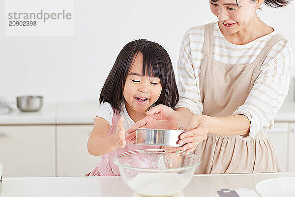 Japanese mother and daughter cooking in the kitchen