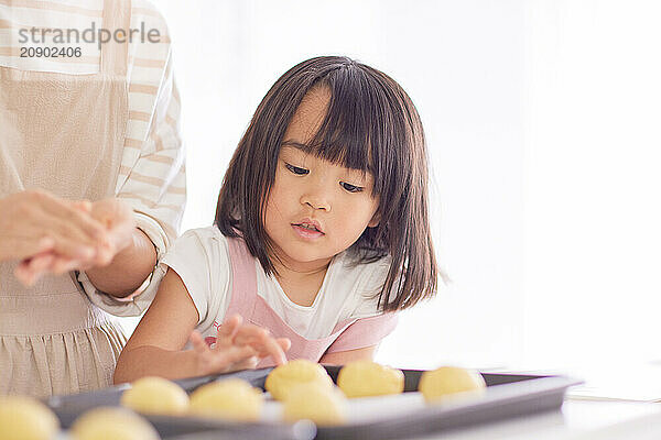 Japanese mother and daughter cooking in the kitchen