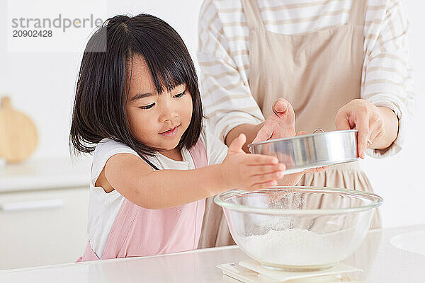 Japanese mother and daughter cooking in the kitchen