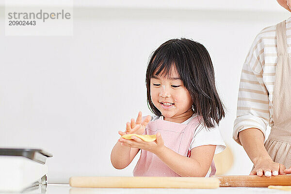 Japanese mother and daughter cooking in the kitchen