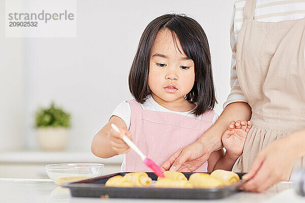 Japanese mother and daughter cooking in the kitchen