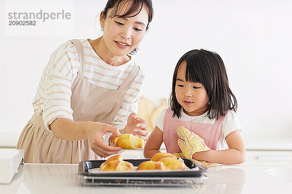 Japanese mother and daughter cooking in the kitchen