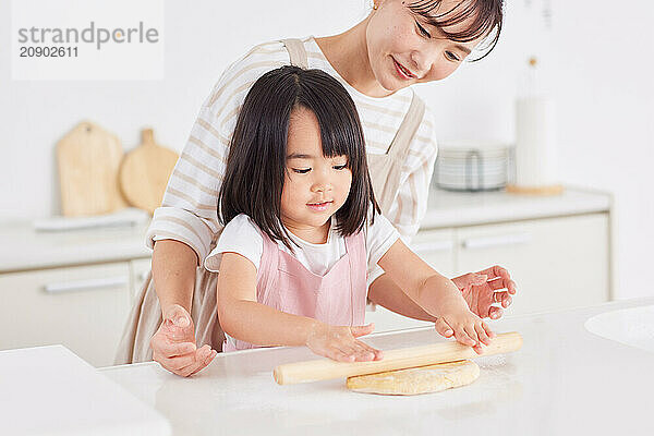 Japanese mother and daughter cooking in the kitchen