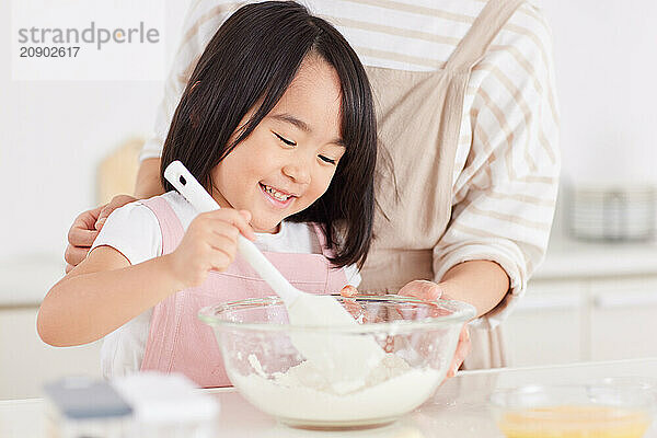 Japanese mother and daughter cooking in the kitchen