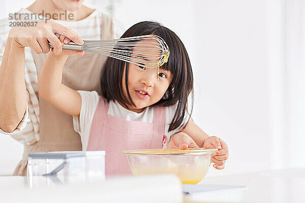 Japanese mother and daughter cooking in the kitchen