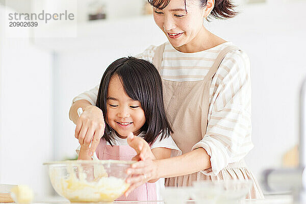 Japanese mother and daughter cooking in the kitchen