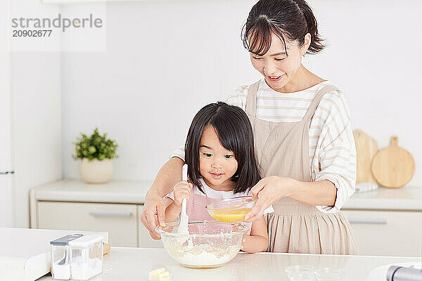 Japanese mother and daughter cooking in the kitchen