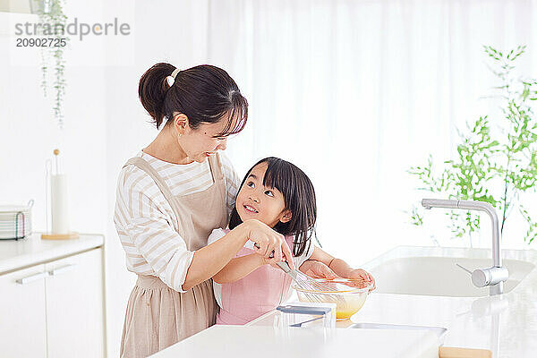 Japanese mother and daughter cooking in the kitchen