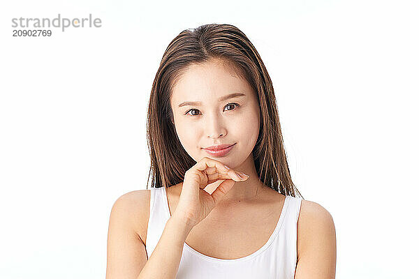 Asian Woman Posing With Her Hand On Her Chin