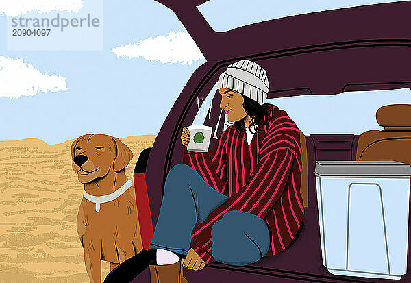 Woman in a striped jacket and beanie sits in the trunk of a car with a dog beside her  both enjoying the desert view.